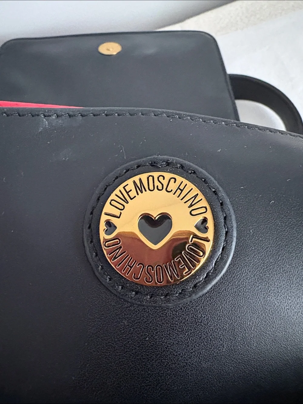 BNWOT Designer LOVE MOSCHINO Backpack, Faux Leather, with gold metal design.